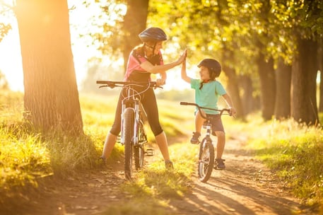 mother and son riding bicycle 